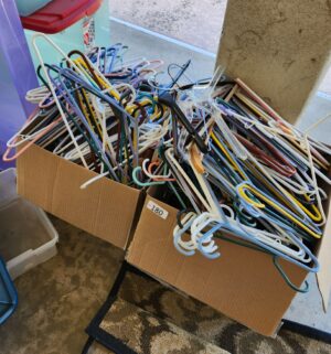 i180- boxes of hangers - Image 1