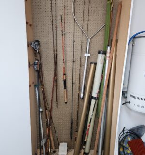 q489- fishing gear in cabinet - Image 1