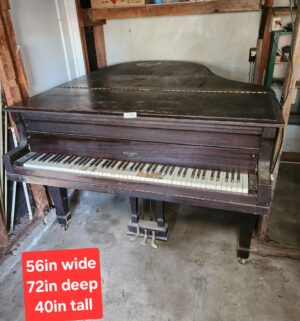 v210- Antique Bush & Gerts Chicago Grand Piano. In Garage
