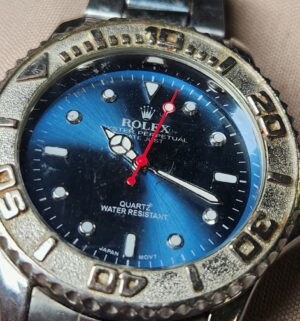 e9- REPLICA Rolex Oyster Perpetual Blue Face Watch. Sold AS IS