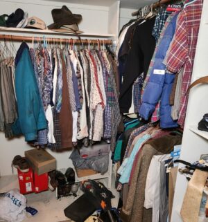 h35- Contents of the master closet all mens clothing, plus several bags