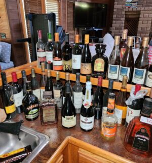 h127- HUGE Collection of decorative bottles w/ contents. Many are sealed.