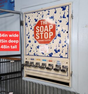 j57- The Soap Stop Vending Center. Out of Order. Bolted to Frame. Buyer to Carefully remove - Image 1