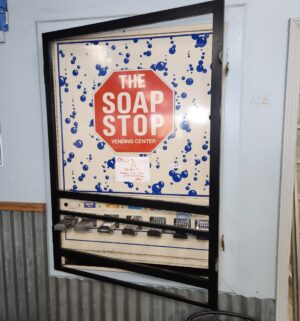 j57- The Soap Stop Vending Center. Out of Order. Bolted to Frame. Buyer to Carefully remove - Image 2