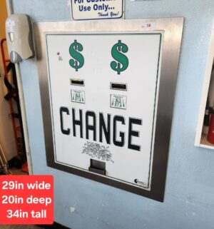 j58- Standard Change Makers Machine. Powers On. No Keys. Locksmith to drill out locks. Buyer to Carefully Remove. - Image 1