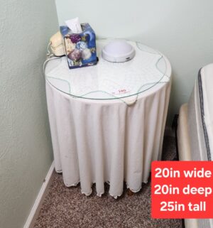 o180- Glass top table w/ skirt