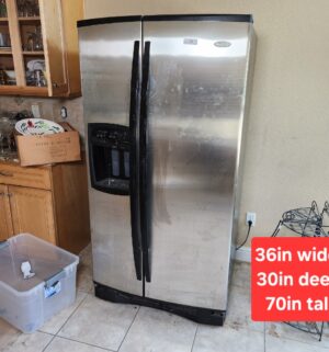 w31- Whirlpool Gold Refrigerator in kitchen. Plugged in and runs. Needs to cleaned. Not hooked up to water. Keeps proper temp