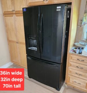 w37- Kenmore Elite Refrigerator w/ water ice. Keeps proper temp. needs a deep cleaning