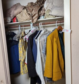 x10- Contents of the 2nd floor closet. Bedding and clothing, jackets