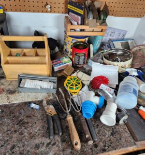 x191- garden tools, misc hardware on workbench