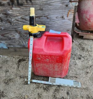 y74- 2.5 gal fuel can w/ some fuel