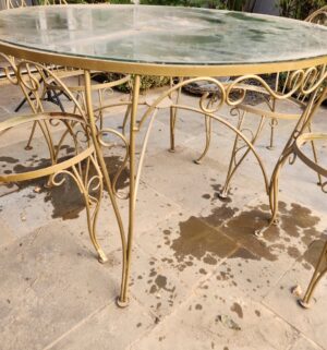 a39- vintage gold-painted wrought iron patio table and chairs set with a glass top - Image 3