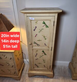 a91- distressed cream-colored wooden single-door accent cabinet with dragonfly decals