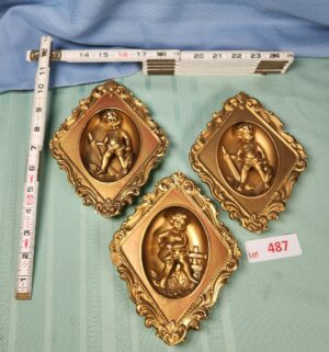 a487- gold-painted cherub wall plaques