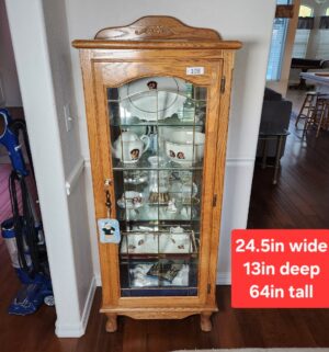 b108- Oak curio cabinet w/ lead glass and key. No contents