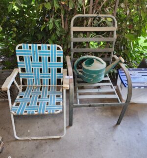 c33- weathered patio chairs, watering can - Image 1
