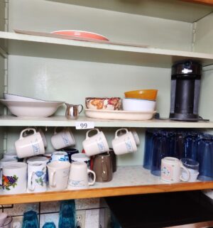 c99- dishes in the cupboard and counter - Image 1
