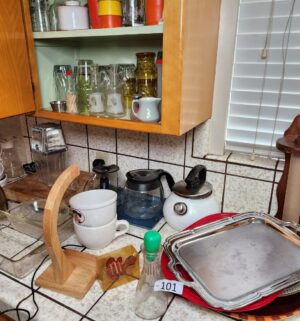 c101- dishes on counter & cupboard - Image 1