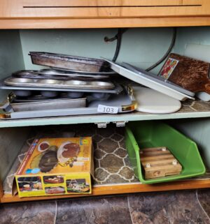 c103- bakeware in cabinet - Image 1
