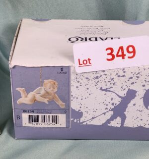 d349- Playing Cherub w/ Box. Lladro