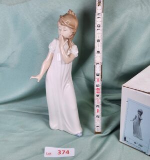d374- Girl Yawning w/ Box. Lladro