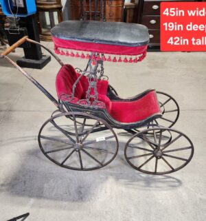 e129- Victorian-era baby carriage, possibly German, featuring a metal frame and red velvet upholstery. - Image 1