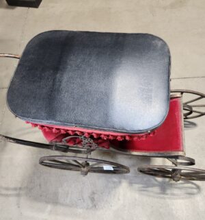 e129- Victorian-era baby carriage, possibly German, featuring a metal frame and red velvet upholstery. - Image 5
