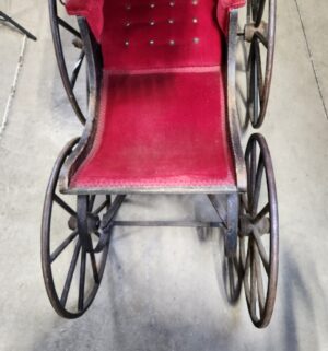 e129- Victorian-era baby carriage, possibly German, featuring a metal frame and red velvet upholstery. - Image 7