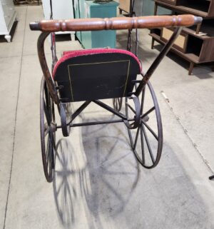 e129- Victorian-era baby carriage, possibly German, featuring a metal frame and red velvet upholstery. - Image 10