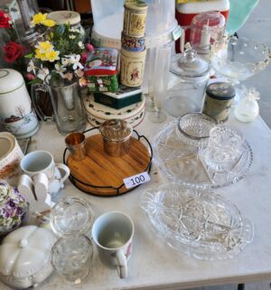 g100- various glass dishes, misc items on table