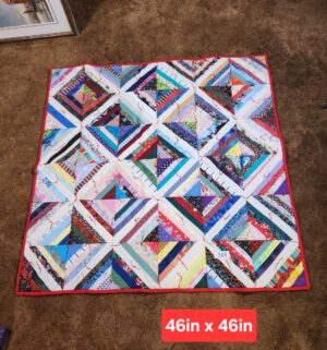 g284- handmade string quilt made from various fabric scraps