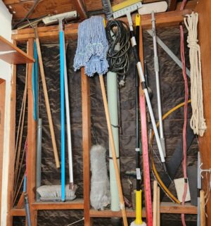 g409- cleaning tools on wall