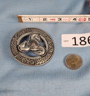 h186- viking style dragon brooch and $2 euro coin