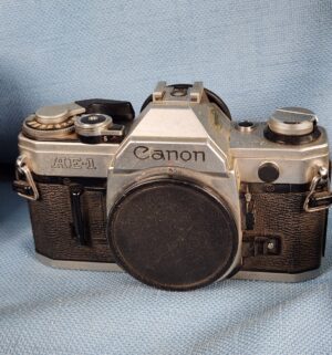 h205- Canon AE-1 Camera w/ accessories - Image 3
