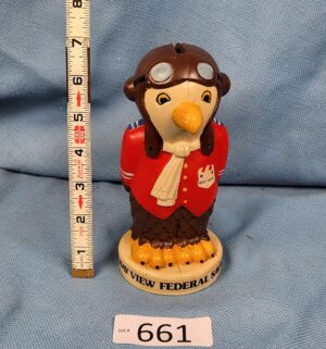d661- 1976 Bay View Federal Savings hard plastic coin bank featuring a bald eagle pilot