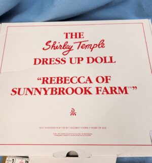 d712- Rebecca of Sunnybrook Farm. Shirley Temple Dress Up Doll