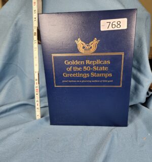 d768- Golden Replicas of the 50 State Greet Stamps. 22kt gold