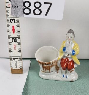 d887- Victorian Man Sitting Playing a Horn With Basket Figurine Occupied Japan