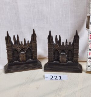 i221- Peterborough Cathedral cast iron bookends. 1928