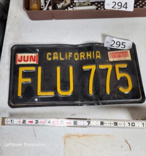 j295- Black & Yellow License Plate FLU775