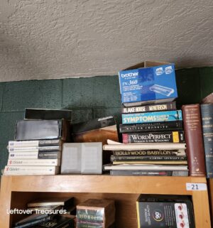 L21- Books, binders on top of bookcases only. Plus magazines in the bookcase