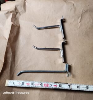 L188- 4 buckets full of metal slatwall display hooks