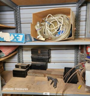 n49- Misc contents on the shelving Unit. Boxes describe contents within