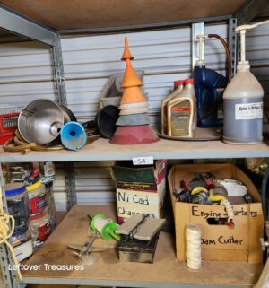 n54- Misc contents on the shelving Unit. Boxes describe contents within