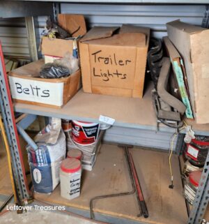 n57- Misc contents on the shelving Unit. Boxes describe contents within