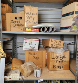 n65- Misc contents on the shelving Unit. Boxes describe contents within
