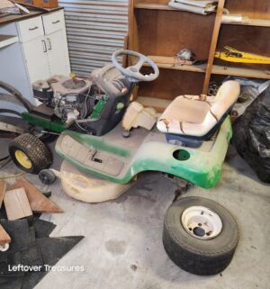 n105- John Deere LT150 Riding Mower. Requires Significant Repair. Sold for parts only