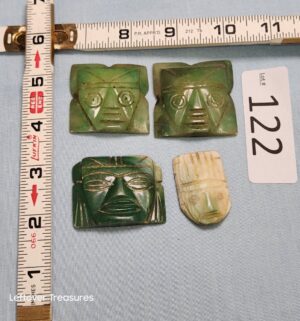 p122- hand-carved stone Faces in a Pre-Hispanic or Mesoamerican style