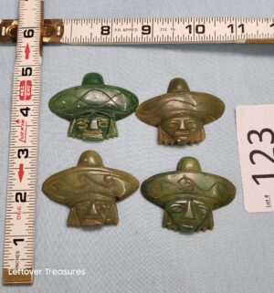 p123- Mexican brooches are crafted from carved presumably jade stone