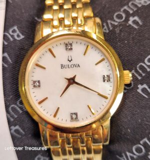 p139- Bulova Ladies Watch w/ Diamonds. Includes Cert & Box